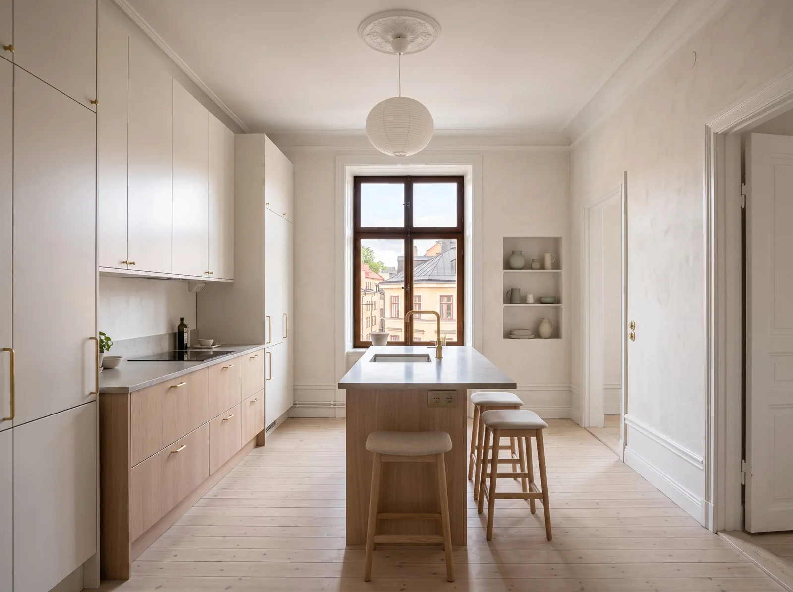 Galley kitchen with extensive cabinetry, a central island and a tall end window